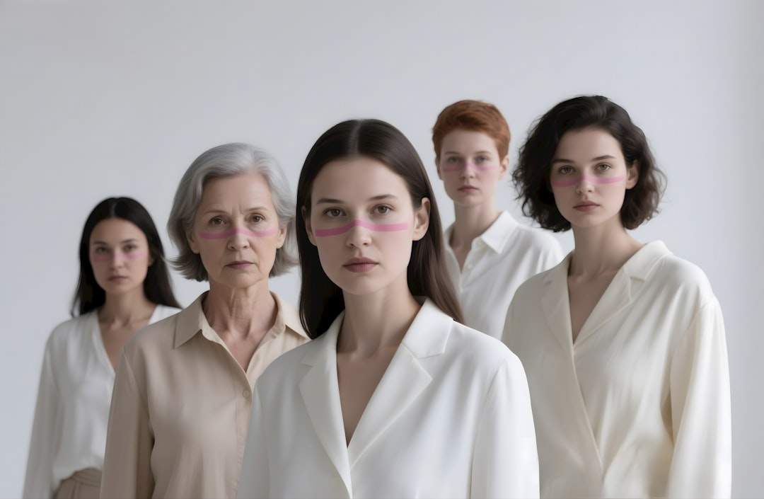 Five women stand facing the viewer